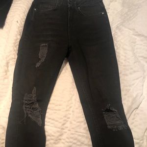 Black ripped skinny jeans with fringe